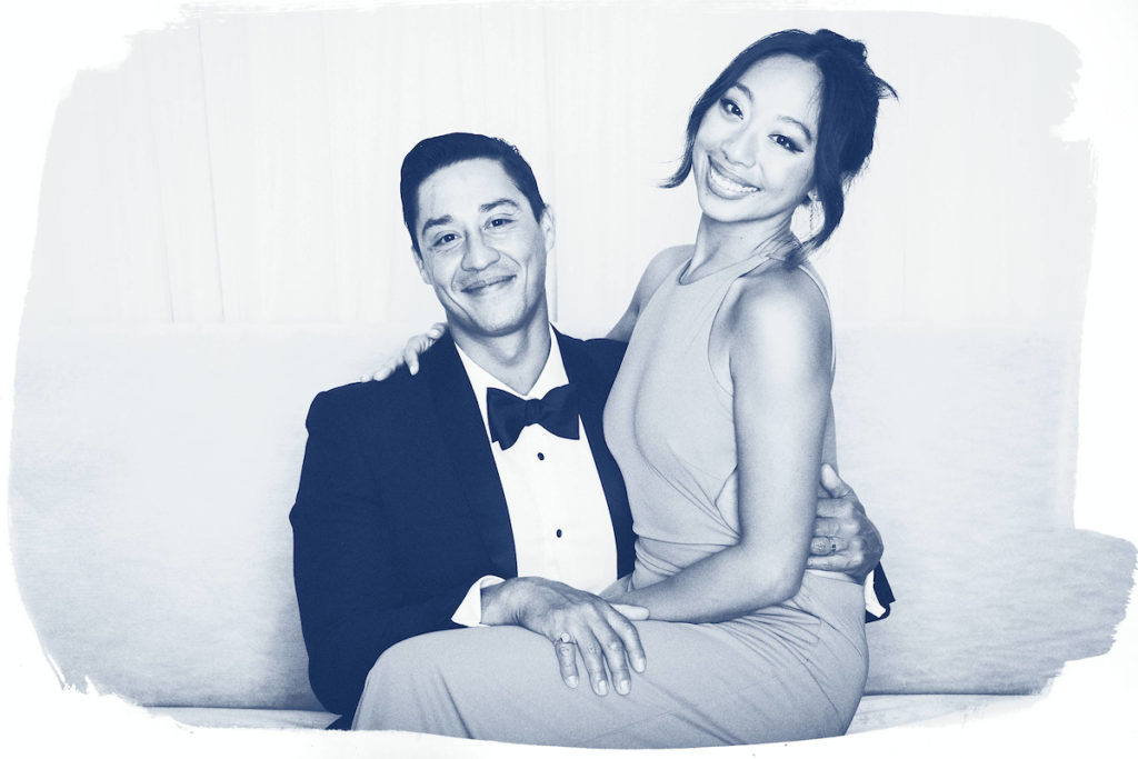 A well-dress couple enjoys the fashion photo booth